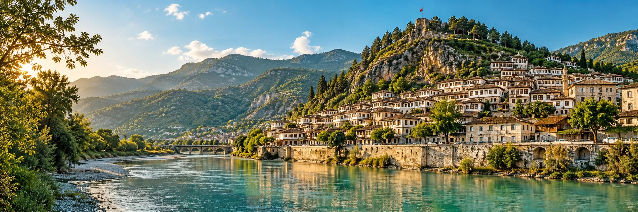 Photographic illustration of Berat's hillside houses, river and mountains in Albania