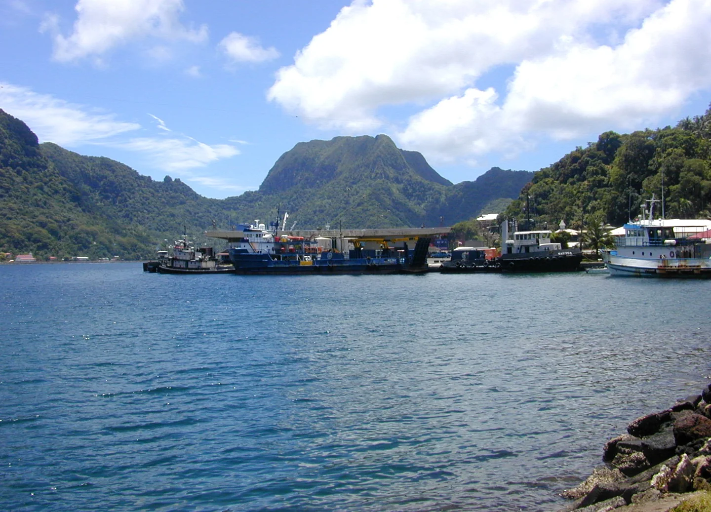 Dock and waterside buildings at Fagatogo with Pioa Mountain behind