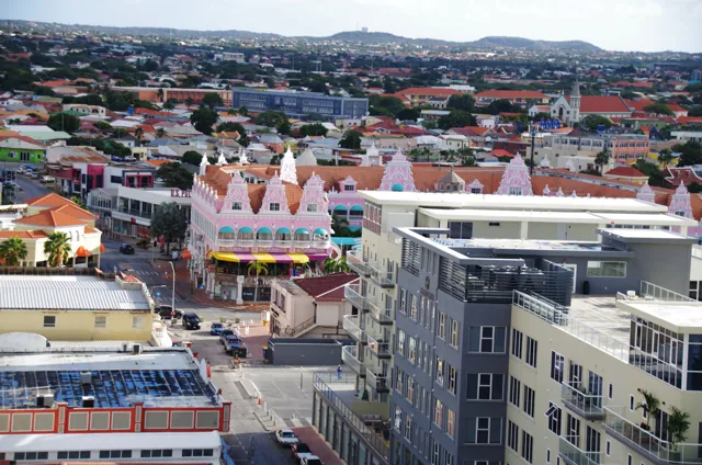 Elevated harbour-side view across colourful Oranjestad buildings and streets