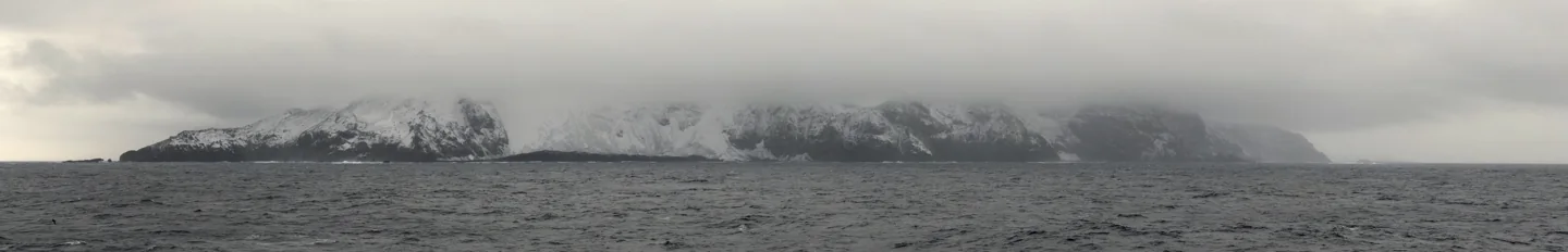 Panoramic photograph of Bouvet Island’s west coast above the ocean