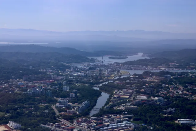 Aerial photograph of Brunei's river, water-village buildings and urban shoreline
