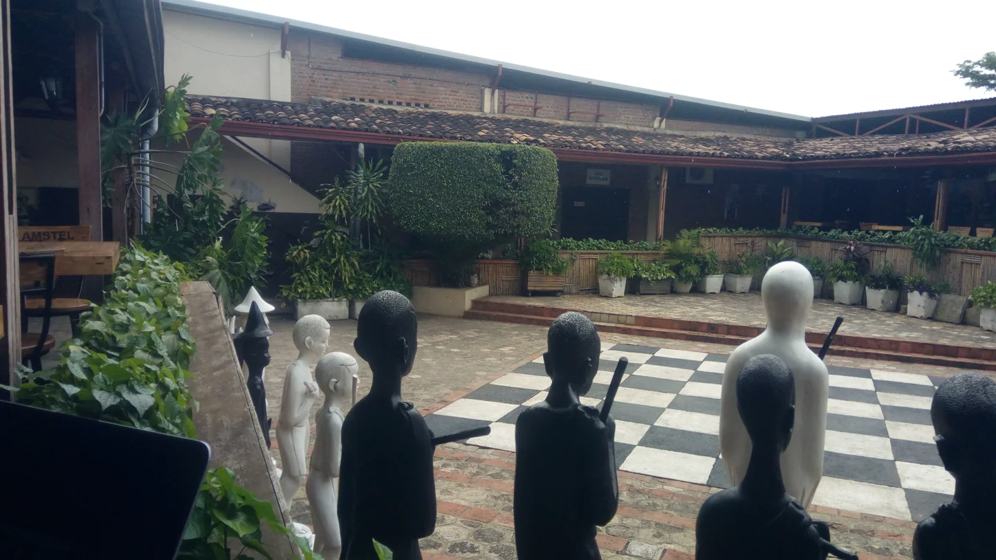 Giant chess pieces and planted seating areas in the Institut français du Burundi courtyard