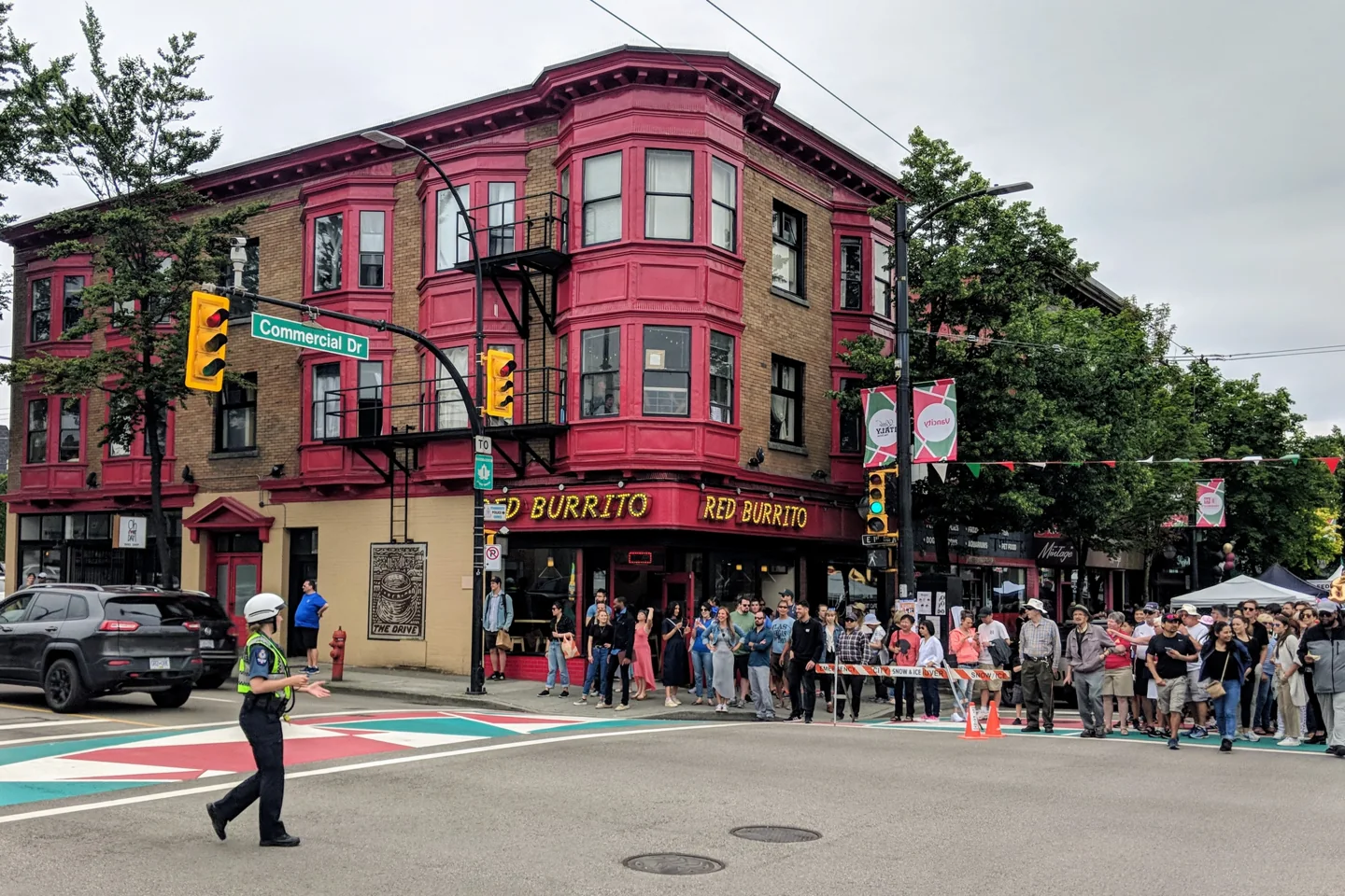 People at a street festival on Commercial Drive in Vancouver