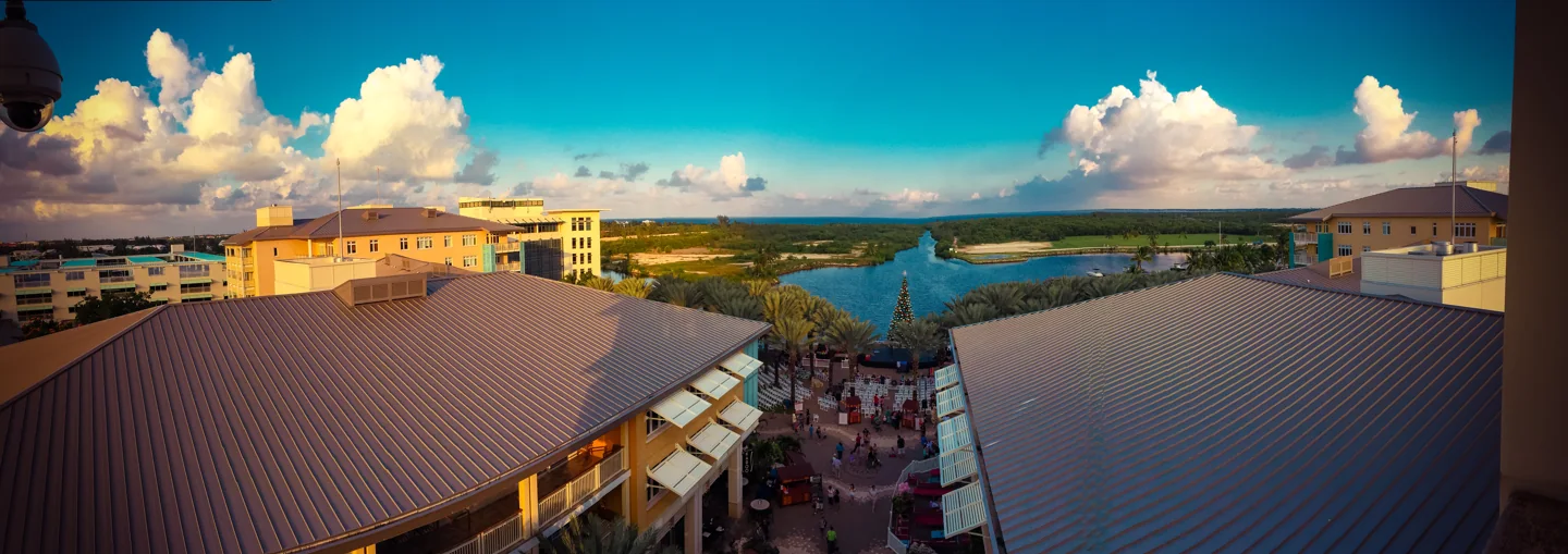 View over the rooftops and public plaza toward the canal at Camana Bay on Grand Cayman