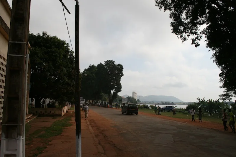 Traffic and roadside activity on a local street in Bangui