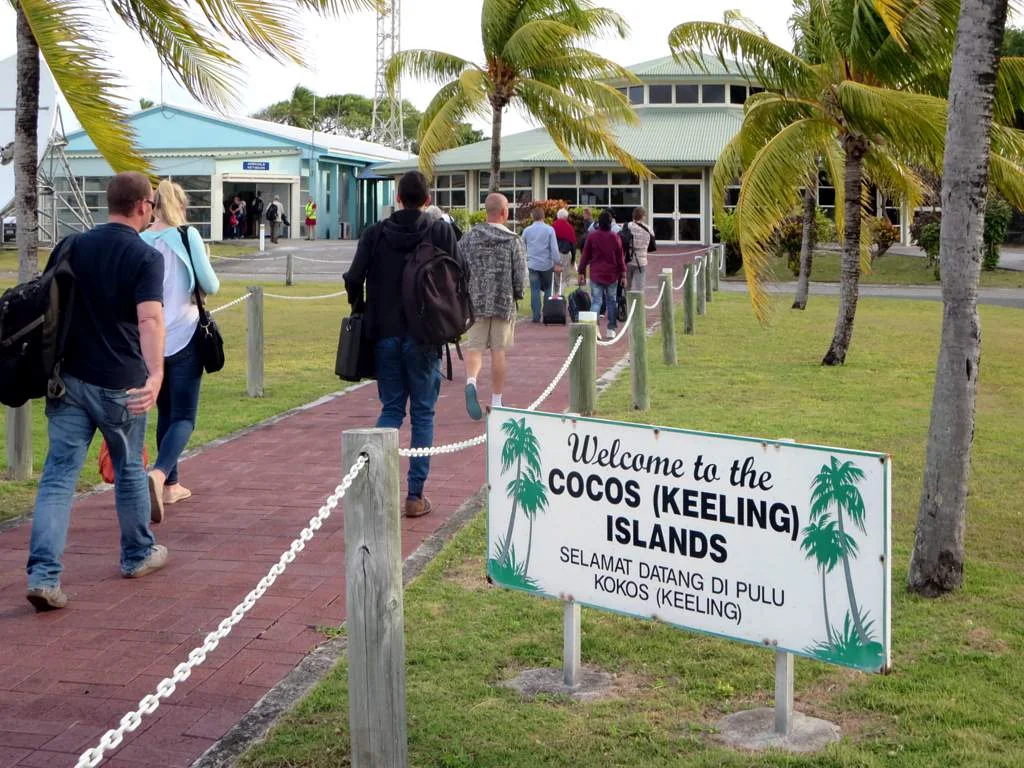 Travellers entering the airport terminal on West Island in 2015