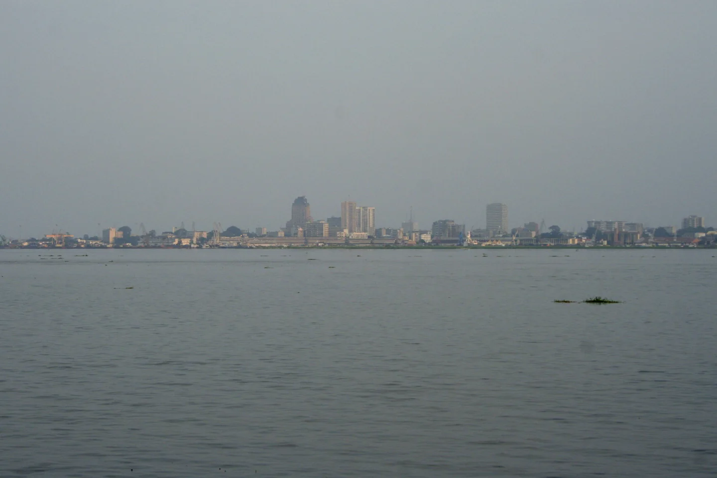The Congo River in front of Kinshasa’s Gombe skyline, viewed from the opposite bank