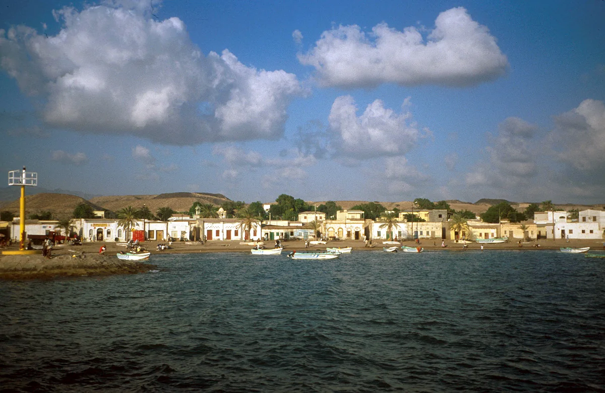 White waterfront buildings of Tadjourah viewed from the sea in a historical photograph