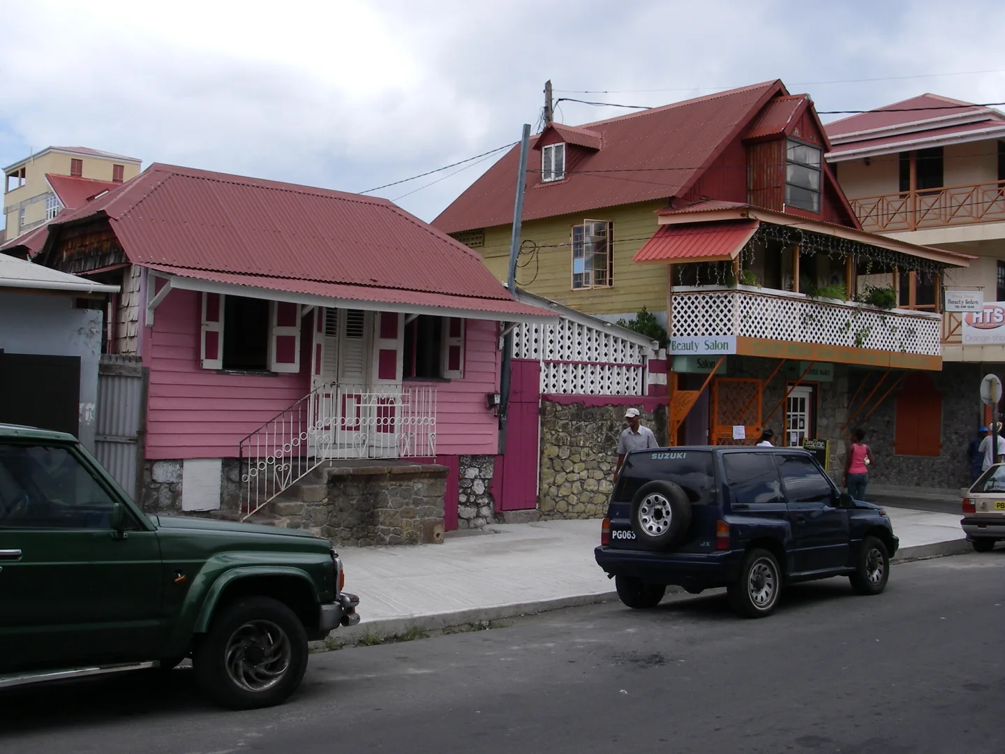 Balconies and shopfronts on a street in Roseau