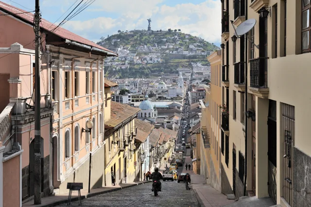 Quito's García Moreno street with El Panecillo in the distance