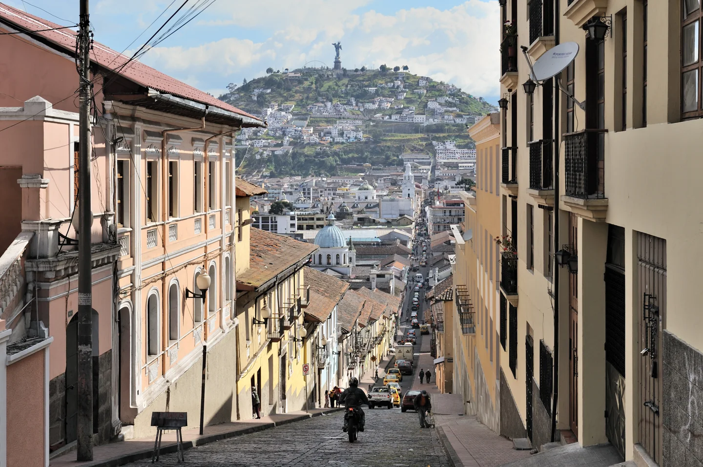 Quito's García Moreno street with El Panecillo in the distance