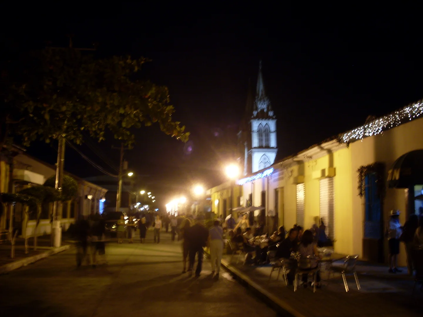 Night-time pedestrian streetscape at Paseo El Carmen in Santa Tecla