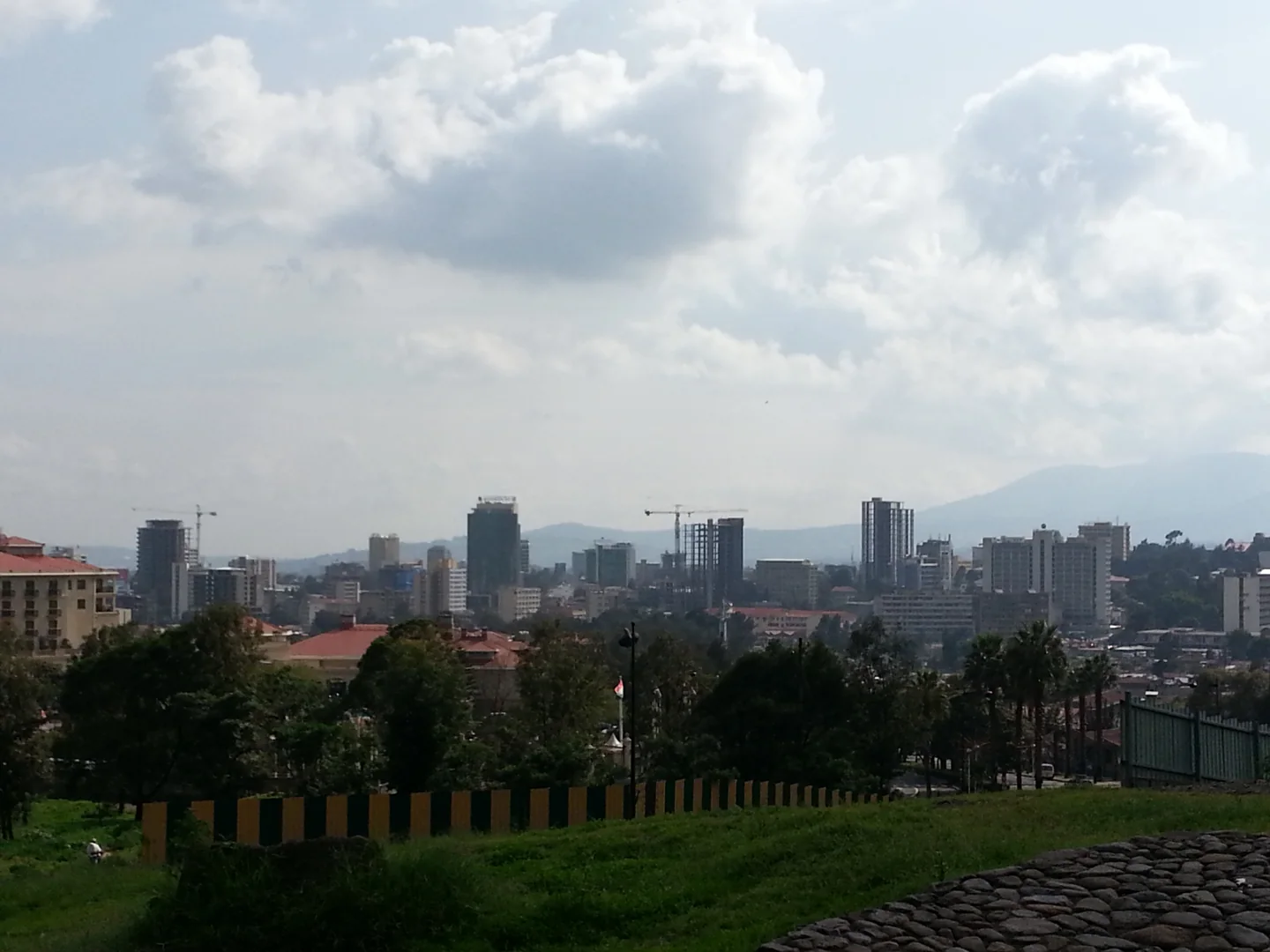 Wide historical panorama of Addis Ababa neighbourhoods and distant skyline